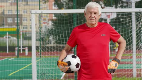 Portrait-of-Retired-Goalkeeper-at-Goal-Net