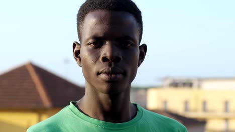 Serious-proud-young-black-american-man-staring-at-camera--outdoor