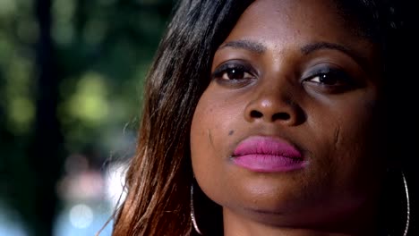 Thoughtful-sad-attractive-young-black-american-woman--outdoor