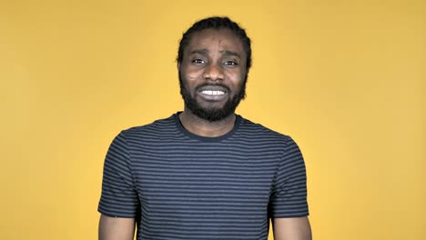 Casual-African-Man-Gesturing-Failure-and-Problems-Isolated-on-Yellow-Background