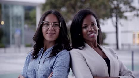 Corporate-agents-posing-with-crossed-arms-and-smiling-at-camera