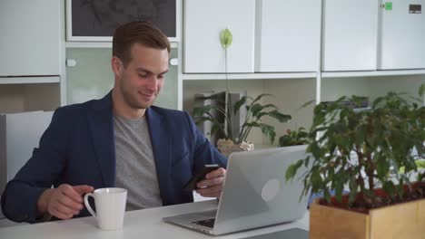 Handsome-man-texting-message-on-the-smartphone