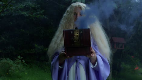 4k-Fantasy-Shot-of-a-Fairy-holding-a-Box-with-smoke