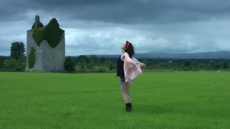 4k-Castle-in-Background-Shot-of-a-Woman-in-Wind