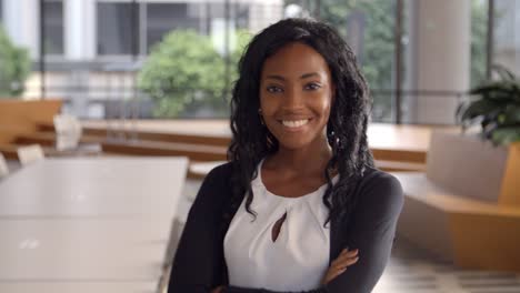 Young-black-businesswoman-walking-into-focal-plane