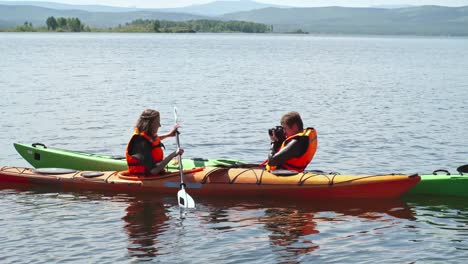 Tourists-Photographing-in-Kayak