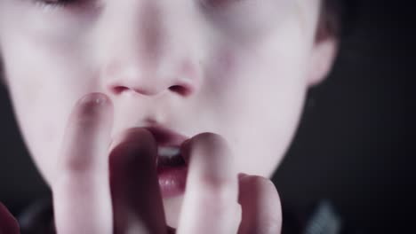 4k-Close-Up-Child-Mouth-Biting-his-Nails