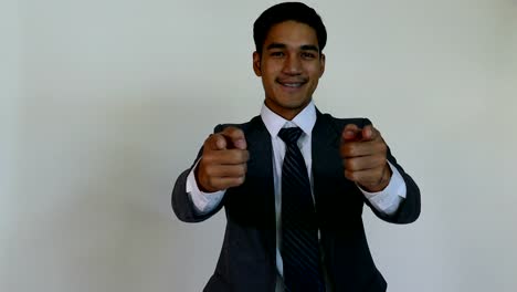 Smiling-young-man-startup-entrepreneur-businessman-wearing-gray-suit-pointing-his-finger-at-you-with-white-background