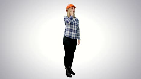 Beautiful-female-engineer-in-hardhat-havin-a-phone-call-correcting-the-project-on-white-background