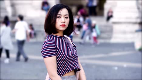 portrait-of-Serious-asian-woman-looks-menacingly-at-the-camera