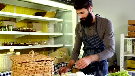 Man-standing-at-counter