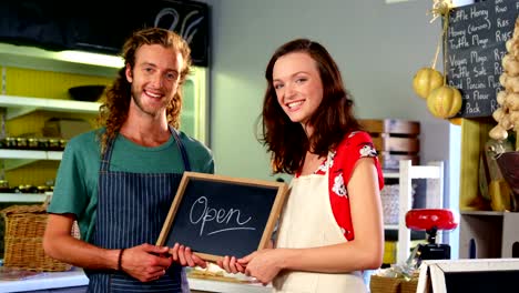 Portrait-of-workers-holding-a-open-sign