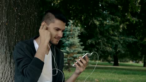 Smiling-young-man-in-the-park