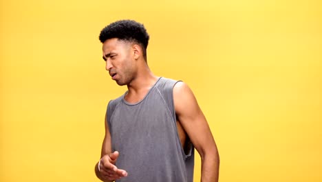 Young-angry-african-man-talking-over-yellow-background.