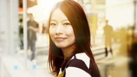 Attractive-Chinese-Woman-in-Urban-Environment.-Looking-at-the-Camera-with-Dark-Eyes-and-Dyed-Hair.