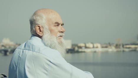 Senior-man-enjoys-river-from-observation-deck