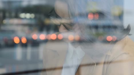 Businesswoman-working-behinad-cafe-window