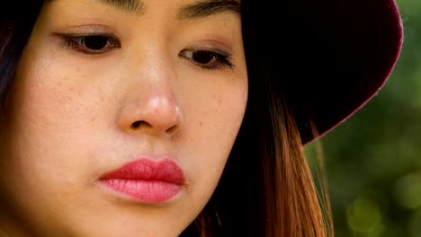 pensive-lonely-sophisticated-asian-woman-thinking,-close-up