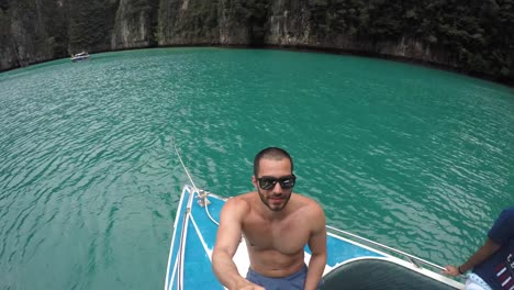 Guy-taking-a-selfie-on-boat-travel