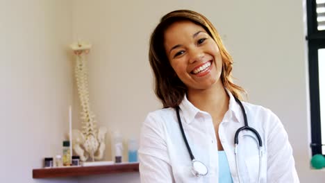 Portrait-of-physiotherapist-standing-with-arms-crossed-4k