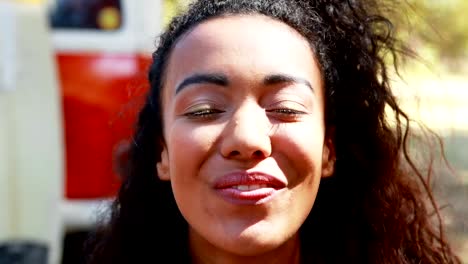 Happy-woman-having-glass-of-beer-in-park-on-a-sunny-day-4k