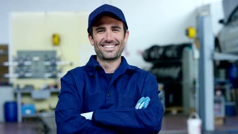 Portrait-of-a-young-beautiful-car-mechanic-in-a-car-workshop,-in-the-background-of-service.-Concept:-repair-of-machines,-fault-diagnosis,-repair-specialist,-technical-maintenance-and-on-board-computer