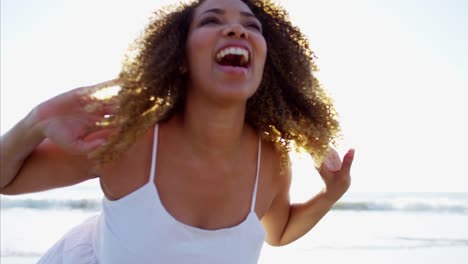 Portrait-of-voluptuous-Ethnic-female-on-sunset-beach