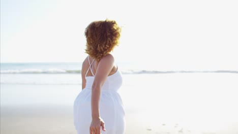 Portrait-of-voluptuous-Ethnic-female-paddling-in-ocean