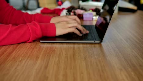 asian-woman-use-computer-at-home.-girl-with-xmas-tree-at-christmas-holiday.-new-year-celebration.-season-greetings