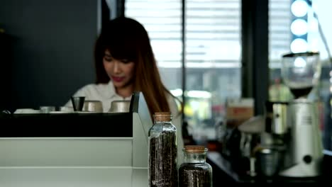 small-business-owner-standing-at-counter-in-coffee-shop.-woman-barista-making-coffee-at-bar-in-cafe.-People,-food-service,-restaurant-concept.