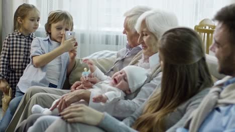 Boy-Taking-Photo-of-Extended-Family