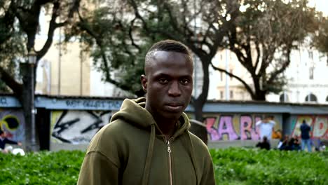 black-african-young-man-staring-at-the-camera-outdoor