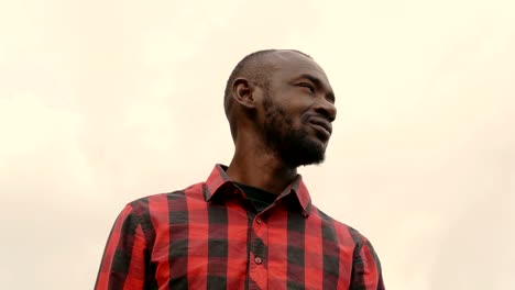 Young-Black-african-man-looking-around--outdoor