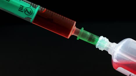 Plastic-medical-syringe-with-needle-and-plastic-vial.-Medical-injection-concept.-Medical-equipment.-4k-resolution.