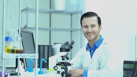 Portraits-of-scientists-looking-through-microscope-and-observe-in-modern-laboratory-or-medical-center.-Concept-of-science,-testing-development-and-lab-industry.