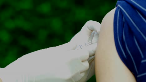 close-up-nurse-giving-a-vaccine-for-a-patient