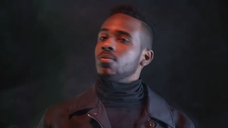 Confident-Man-in-Dark-Studio-with-Fog