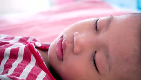 Boy-sleeping-on-bed