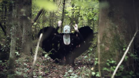 4k-Halloween-Dark-Angel-Woman-with-Black-Wings-in-Forest-Screaming