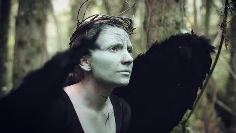 4k-Halloween-Dark-Angel-Woman-with-Black-Wings-in-Forest-Looking-Scared