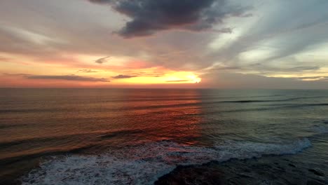 aerial-over-ocean-towards-radiant-sunset