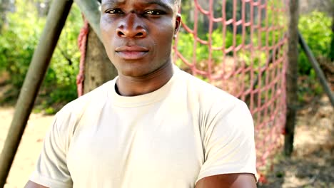 Portrait-of-fit-man-standing-with-arms-crossed