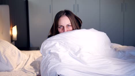 The-ill-woman-wrapping-herself-up-in-the-blanket.-Close-up.