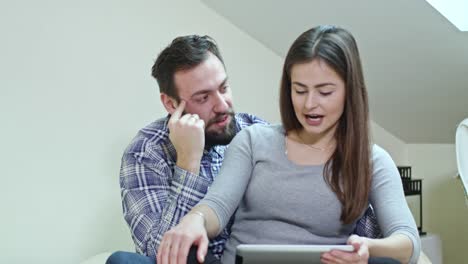 Using-a-Digital-Tablet-Sitting-on-a-Bed-at-Home