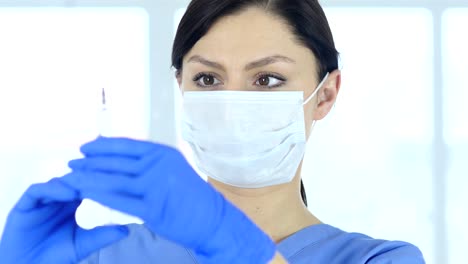 Close-Up-of-Doctor-in-Mask-Holding-Injection,-Ready-to-inject