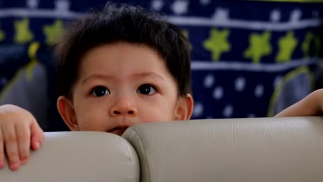 cute-baby-boy-happy-smile-in-fluffy-mattress-partition-protection-area