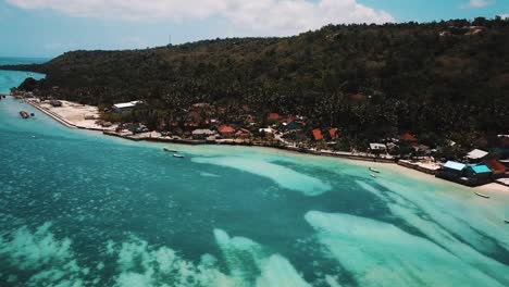 Crystal-Clear-Water-Zoomed-Out-To-Reveal-Tropical-Island-4K