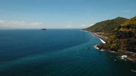 Tropical-landscape,-sea,-beach,-mountains