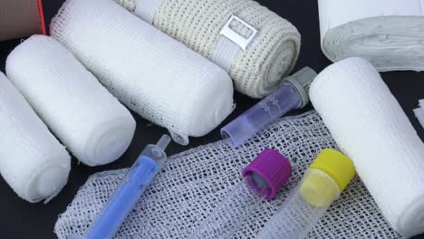 Medical-bandages-with-adhesive-tape-and-syringes-for-medical,-health-care-or-pharmacy-themes.-Medical-environment-instruments.