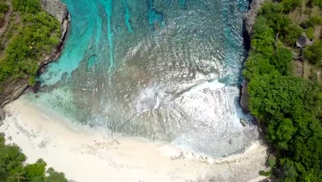 Aerial-view-drone-point-of-view-4K-resolution-of-white-sand-beach-and-blue-lagoon--Indonesia-Travel-no-people-nature-discovery-environment-concept